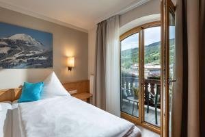 Postel nebo postele na pokoji v ubytování Alpen Glück Hotel Unterm Rain garni