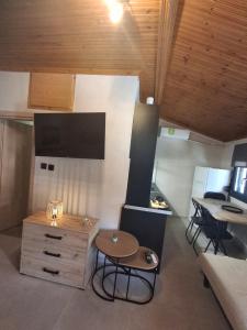 a small room with a table and a tableablish at Villa seniorita Annita in Nikiti +14 photos