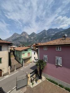 a view of a town with mountains in the background at Albergo Al Borghetto in Mezzolombardo +19 photos