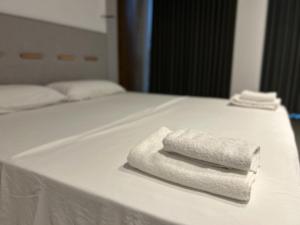 Postel nebo postele na pokoji v ubytování Escape Suites