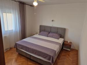 Postel nebo postele na pokoji v ubytování Apartman Martinovic