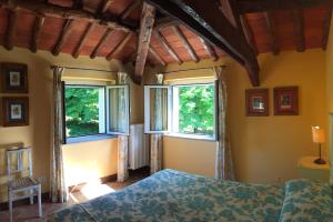 Ένα ή περισσότερα κρεβάτια σε δωμάτιο στο TENUTA MONTEGRANDE 1893 +88 φωτογραφίες