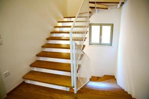 a spiral staircase in a house with a window at Mora Mora - Apartments in San Benedetto del Tronto