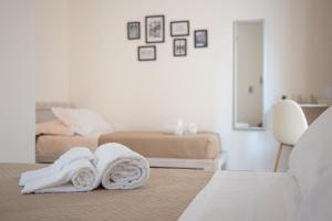 Giường trong phòng chung tại Da Zia Manny