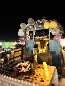 a table with a bunch of balloons on it at Mons Masius Hotel Teras in Midyat