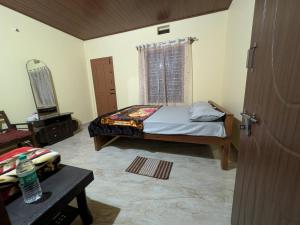 Postel nebo postele na pokoji v ubytování Coorg Milestone Homestay