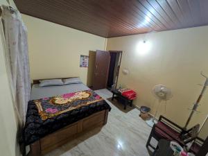 Postel nebo postele na pokoji v ubytování Coorg Milestone Homestay