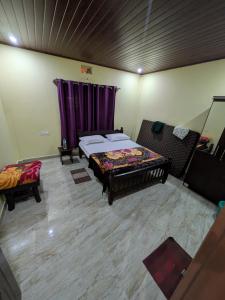 Postel nebo postele na pokoji v ubytování Coorg Milestone Homestay