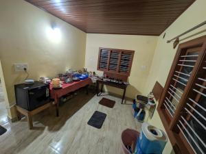 Postel nebo postele na pokoji v ubytování Coorg Milestone Homestay