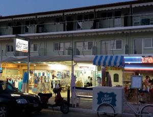 a scooter parked in front of a store at Tzakis Studios Lassi in Argostoli