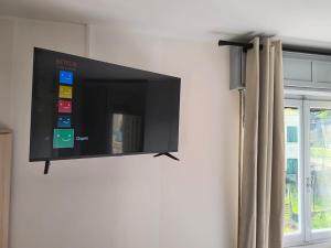 a flat screen tv hanging on a wall at B&B a San Michele da Maja in Gardone Riviera