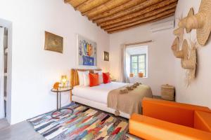 a bedroom with a bed and a couch at Dar Syada Boutique Hotel Marrakech in Marrakech +264 photos