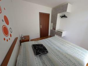 Posteľ alebo postele v izbe v ubytovaní Apartments Jurišević