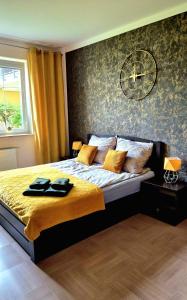 Ένα ή περισσότερα κρεβάτια σε δωμάτιο στο Levilena apartament Osiedle Bałtyk
