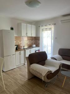 Kuchyň nebo kuchyňský kout v ubytování Apartman Nina2