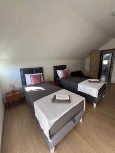 Postel nebo postele na pokoji v ubytování Apartman Nina2
