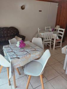 a dining room with a table and chairs at Swallow13 in Centurion