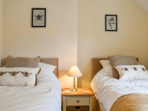 Postel nebo postele na pokoji v ubytování Peppercorn Cottage + 4 fotografie