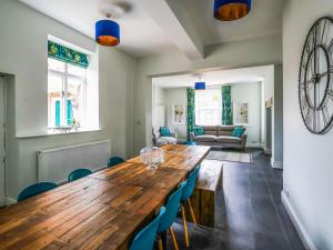 a dining room with a wooden table and chairs at Salt House - Uk43012 in Berkeley