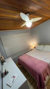 a bedroom with a bed and a ceiling fan at Paradise for your family next to Porto Alegre in Eldorado do Sul +36 photos