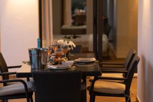 a dining room table with dishes and drinks on it at Villas Mamma Mia pool heat Private & Jacuzzi in Playa Blanca +110 photos