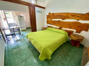 Ένα ή περισσότερα κρεβάτια σε δωμάτιο στο Casitas de Norma +51 φωτογραφίες