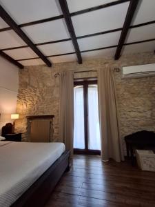 Postel nebo postele na pokoji v ubytování Antica Dimora Historic Building