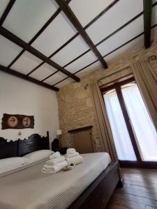 Postel nebo postele na pokoji v ubytování Antica Dimora Historic Building