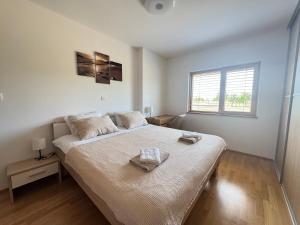 Postel nebo postele na pokoji v ubytování Capo House