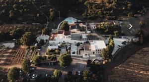 an aerial view of a large white house at Masseria Paretano in Santa Lucia +19 photos