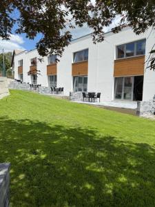 a building with a lawn in front of it at Diamond Houses in Námestovo +9 photos