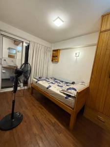 a bedroom with a bed and a camera in a room at Hidden Courtyard Walkhu in Pātan