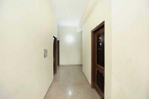 an empty hallway with two doors and a hallway at OYO 91941 Hotel golden crown in Sirhind