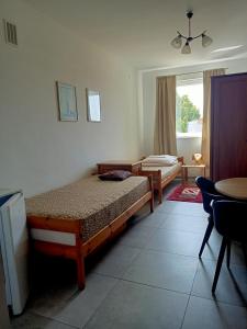 Ένα ή περισσότερα κρεβάτια σε δωμάτιο στο Agroturystyka Maria Preca