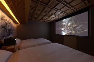 Katil atau katil-katil dalam bilik di Machiya Hideaway in Enchanting Geisha District