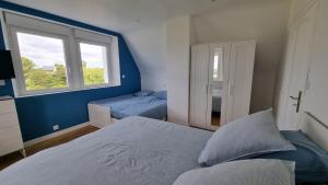 Postel nebo postele na pokoji v ubytování Gîte Le Grand Bleu + 23 fotografií