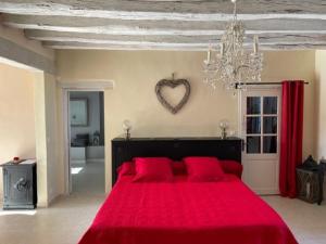 Posteľ alebo postele v izbe v ubytovaní GITE ROMANTIQUE