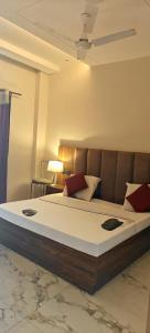 a bedroom with a large bed in a room at Abhiraj Guest House in Mathura +22 photos