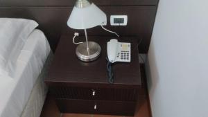 Voodi või voodid majutusasutuse MC Hotel toas