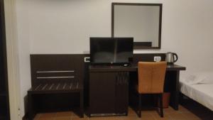 Voodi või voodid majutusasutuse MC Hotel toas