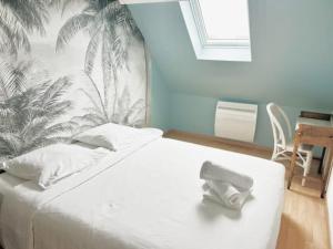Posteľ alebo postele v izbe v ubytovaní Gold beach gîte