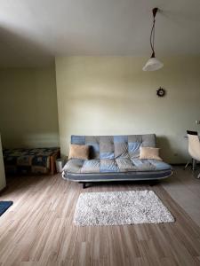 a living room with a couch in a room at 'Oasis' Ravda Apartment, Nessebar in Ravda +26 photos