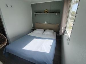 a small bedroom with a bed and a window at Cap du Roc in Port-la-Nouvelle +15 photos