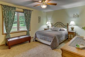 a bedroom with a bed and a window at 2 Mi to Woodbury Wildlife Area Cozy Farmhouse! in Warsaw