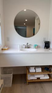 a bathroom with a sink and a mirror at Seasonal Cabin, sleeps 6 in Lake City