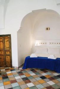 Ένα ή περισσότερα κρεβάτια σε δωμάτιο στο Domus Magistri