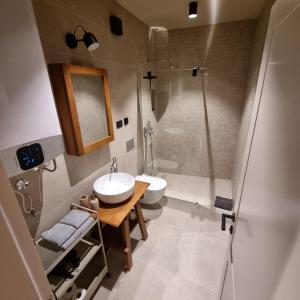 a bathroom with a sink and a shower at Old Town Vrsar Premium Apartments in Vrsar