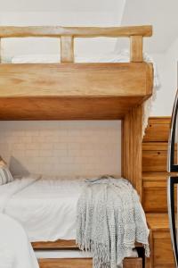 two bunk beds in a bedroom with white sheets at CABIN STUDIO in KL TOWER, Greenbelt, Makati! Max Capacity 6 pax! in Manila +60 photos
