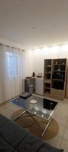 a living room with a couch and a table at villa Lucciana in Lucciana