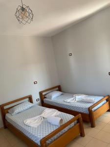 Postel nebo postele na pokoji v ubytování Begaj Rooms
